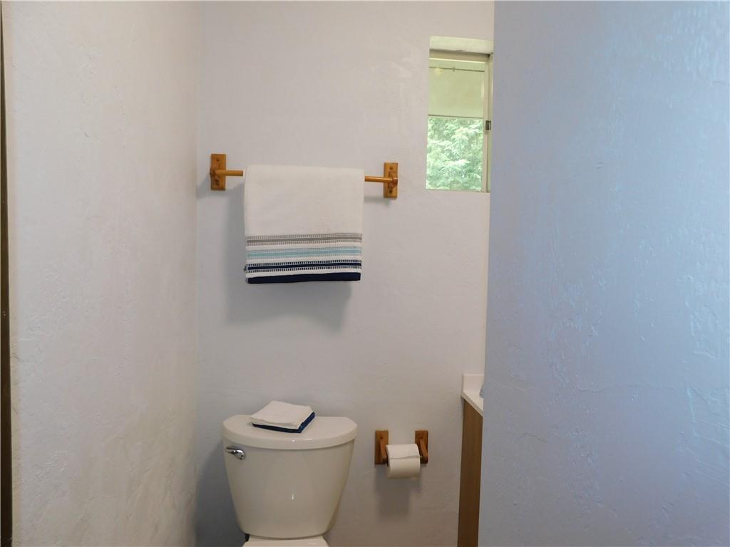 367 Pike School Road Markleysburg, PA 15459 - Photo 15 of 16 a bathroom with a toilet and a window