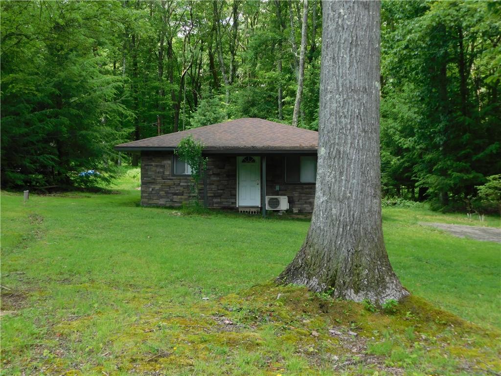 367 Pike School Road Markleysburg, PA 15459 - Photo 2 of 16 a front view of a house with a garden
