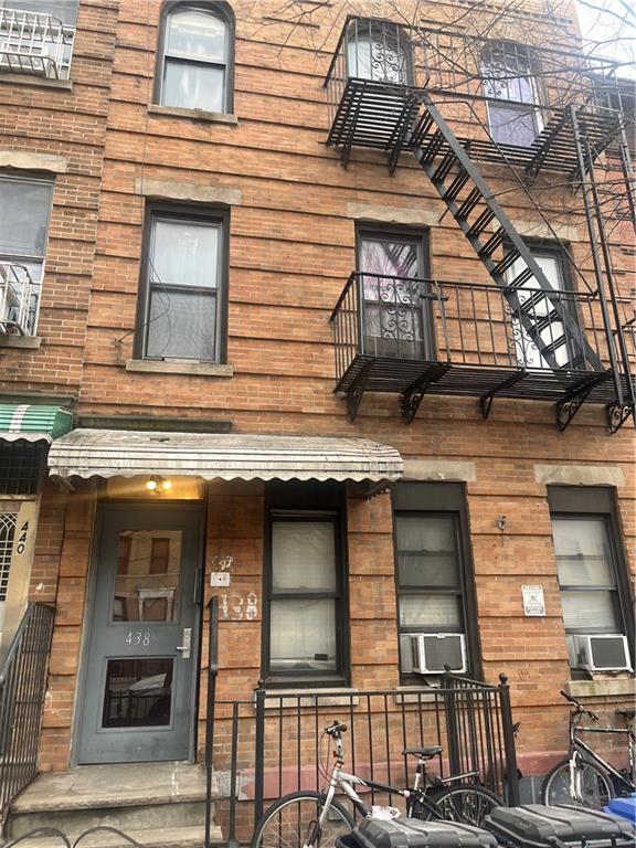 438 60th Street Brooklyn, NY 11220 - Photo 1 of 2 a building with a window and balcony