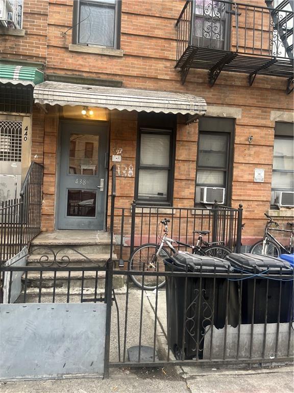 438 60th Street Brooklyn, NY 11220 - Photo 2 of 2 a front view of a building with a table and chairs