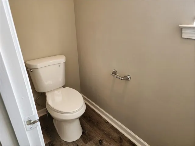 a white toilet sitting in a bathroom