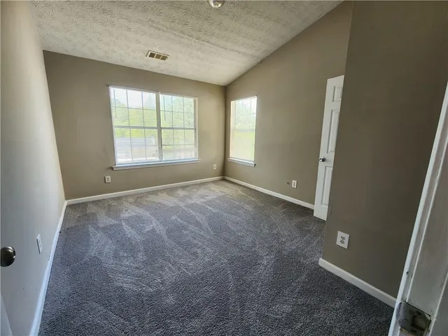 wooden floor and window in an empty room