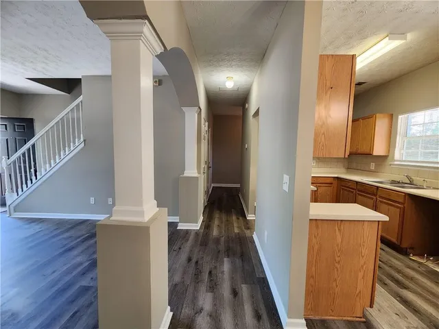 a view of hallway with wooden floor