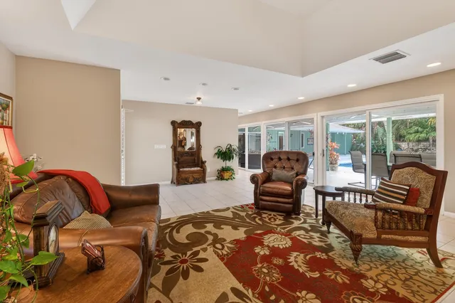 a living room with furniture fireplace and flat screen tv