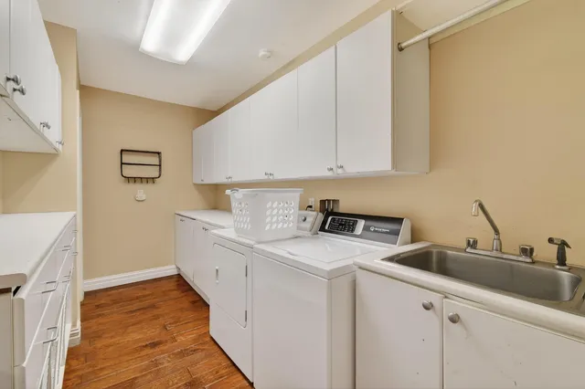 a bedroom with furniture and a large window