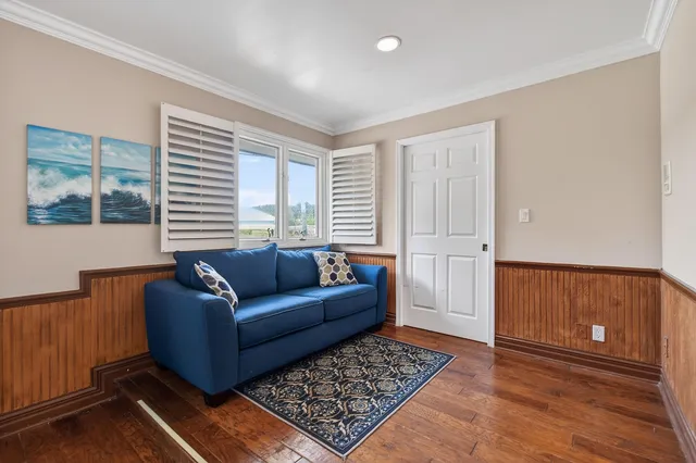 a view of a house with pool and sitting area