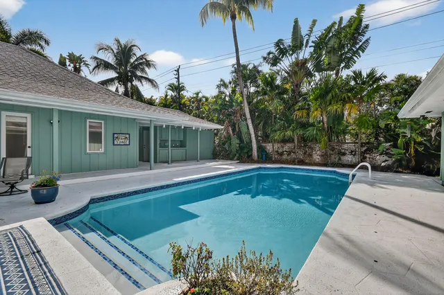 a kitchen with stainless steel appliances granite countertop a refrigerator sink and cabinets