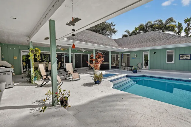 a view of a house with a yard and a garage