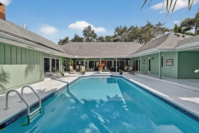 an aerial view of residential building with parking