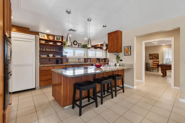 a living room with furniture a ceiling fan and a rug