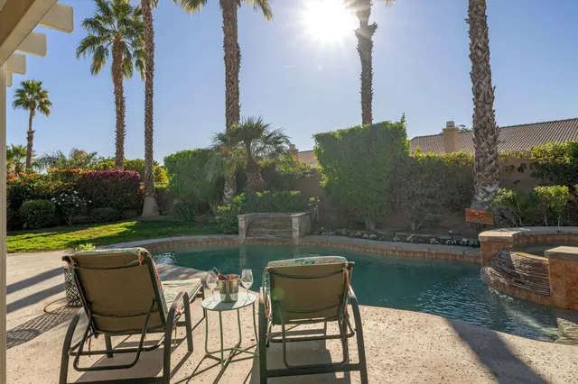 a view of a chairs and table in the patio