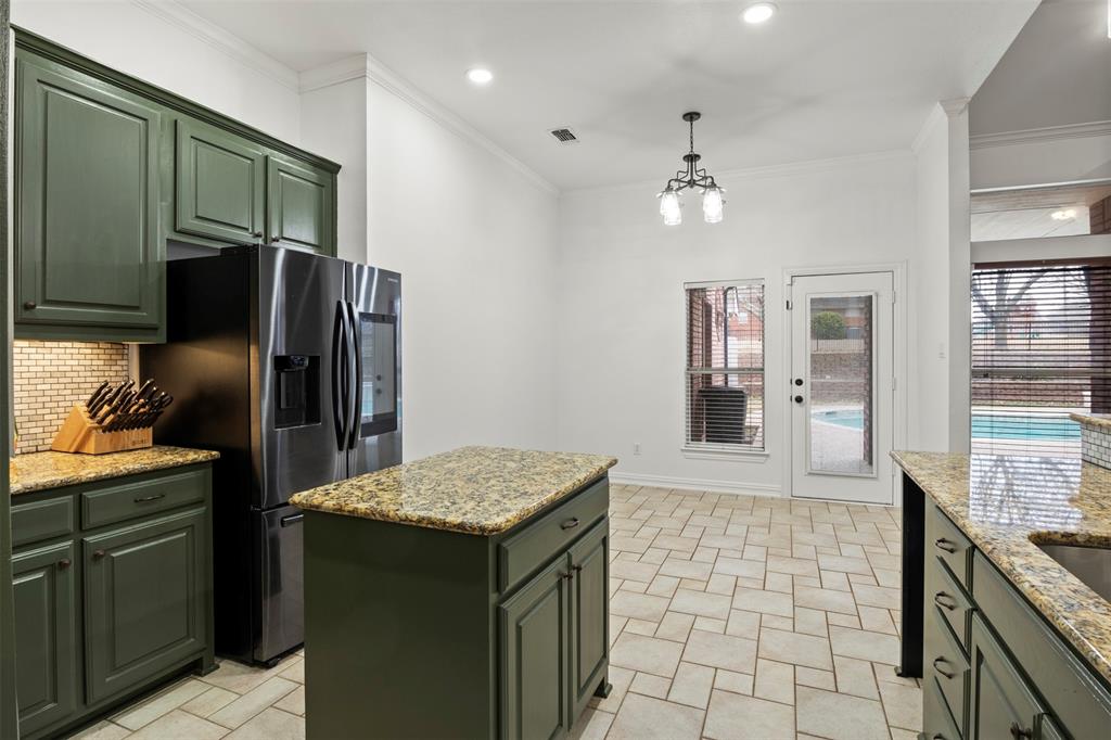 364 Preakness Place Road Van Alstyne, TX 75495 - Photo 15 of 40 a kitchen with stainless steel appliances granite countertop a sink stove and refrigerator