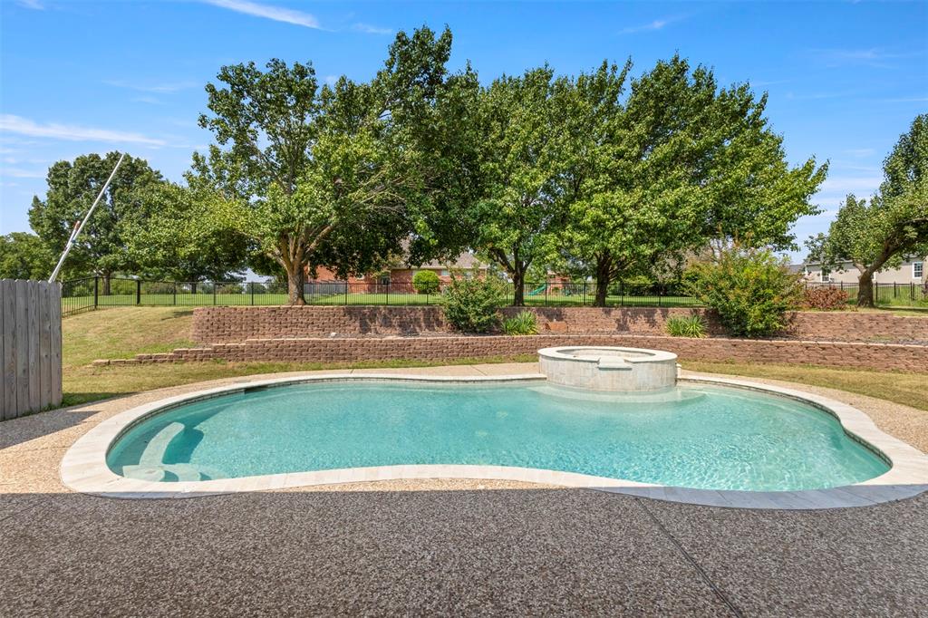 364 Preakness Place Road Van Alstyne, TX 75495 - Photo 2 of 40 a view of a swimming pool with a sitting area
