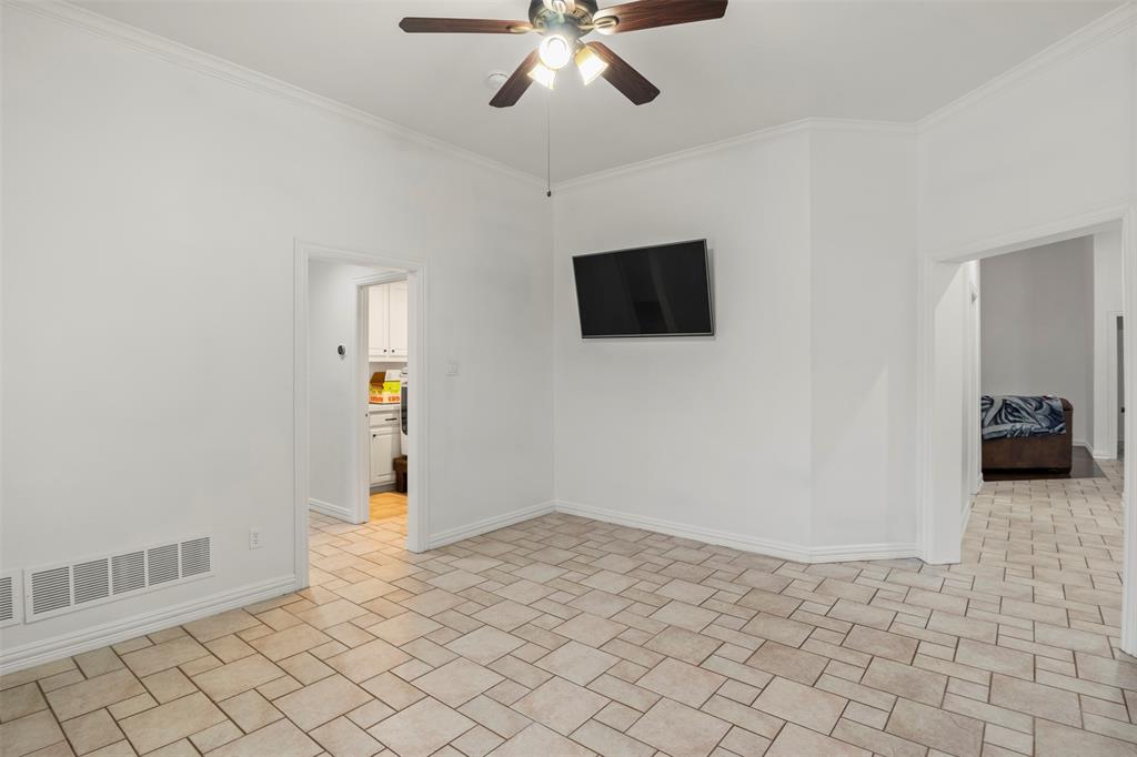 364 Preakness Place Road Van Alstyne, TX 75495 - Photo 23 of 40 a view of a livingroom with wooden floor and a ceiling fan