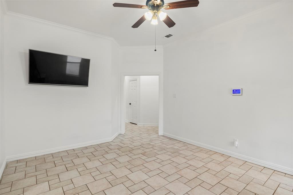 364 Preakness Place Road Van Alstyne, TX 75495 - Photo 24 of 40 a view of a livingroom with an empty space and a flat screen tv