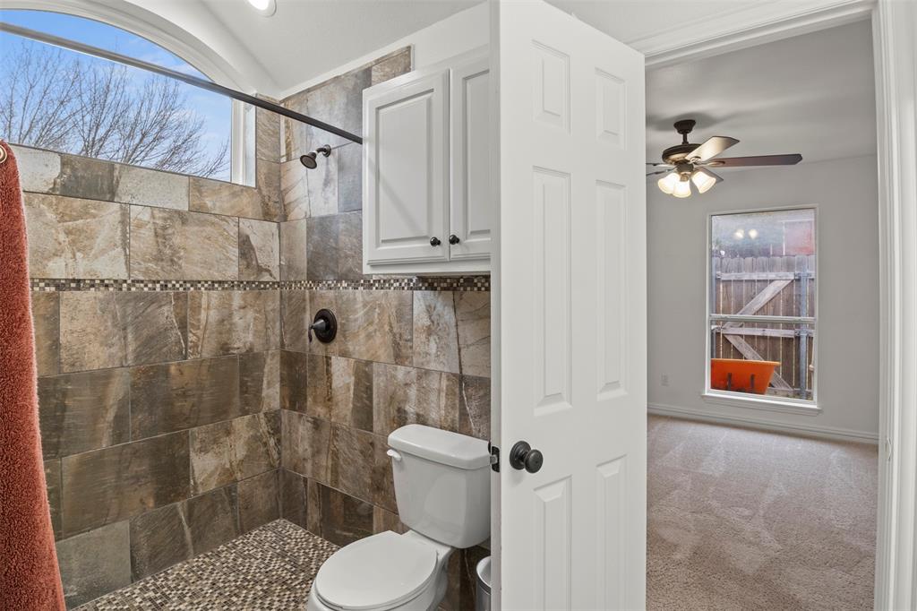 364 Preakness Place Road Van Alstyne, TX 75495 - Photo 30 of 40 a bathroom with a shower toilet and sink