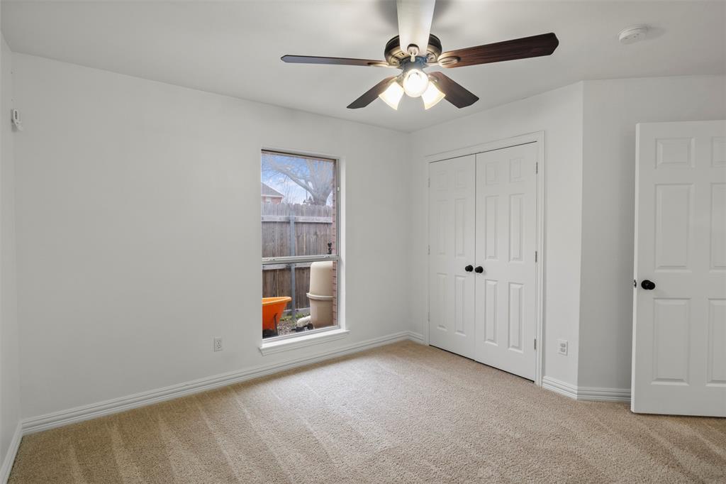364 Preakness Place Road Van Alstyne, TX 75495 - Photo 31 of 40 an empty room with closet and fan