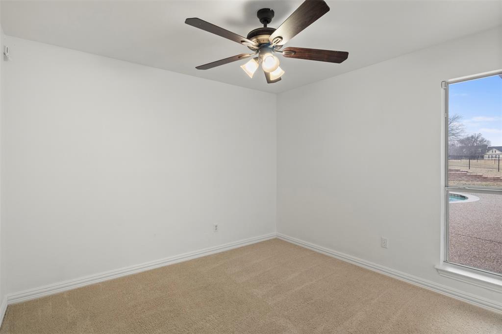 364 Preakness Place Road Van Alstyne, TX 75495 - Photo 35 of 40 an empty room with a chandelier fan