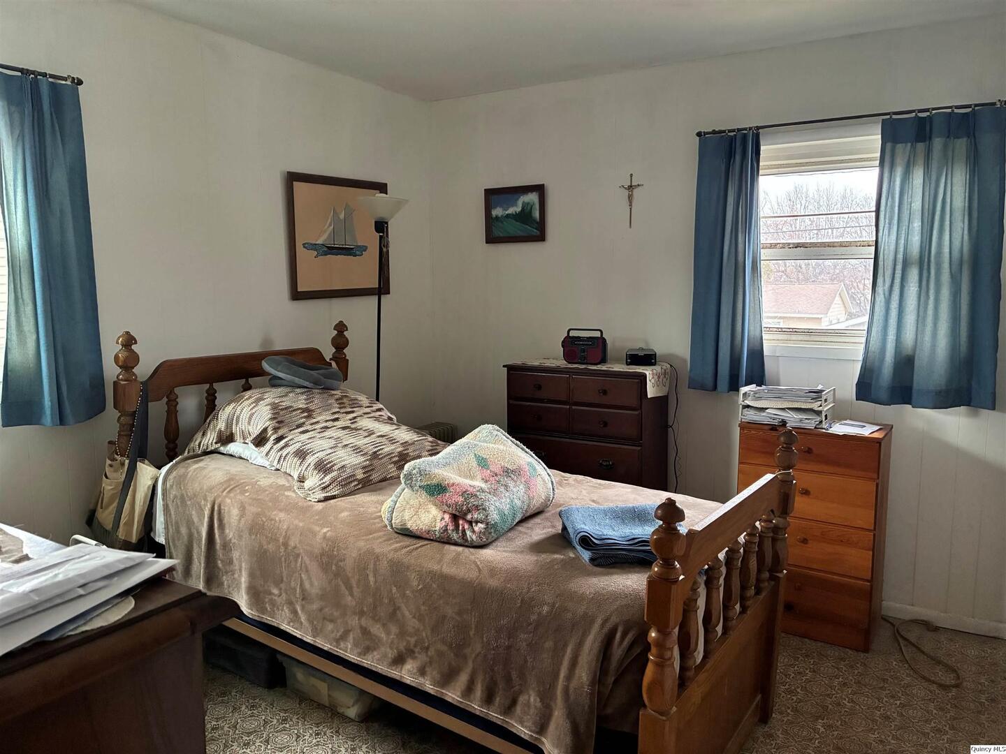 3409 Lawrence Road Quincy, IL 62301 - Photo 5 of 11 a bedroom with two beds and a dresser