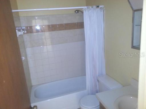 2192 Knox McRae Drive, Unit H Titusville, FL 32780 - Photo 6 of 6 a bathroom with a shower and a toilet