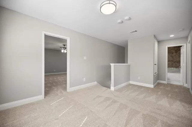 an empty room with closet and a window