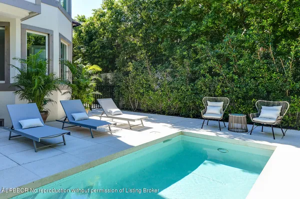 a view of a backyard with sitting area