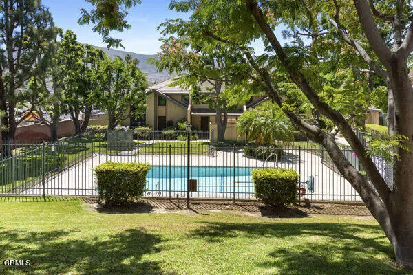 a view of a backyard with sitting area
