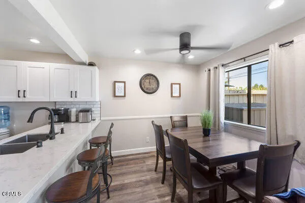 a view of a dining room with furniture window and outside view