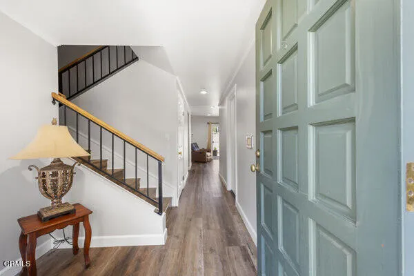 a view of entryway with wooden floor