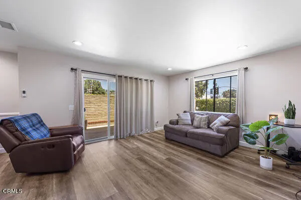 a living room with furniture and a window