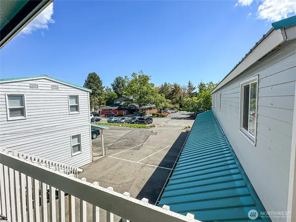 a view of a backyard with sitting area