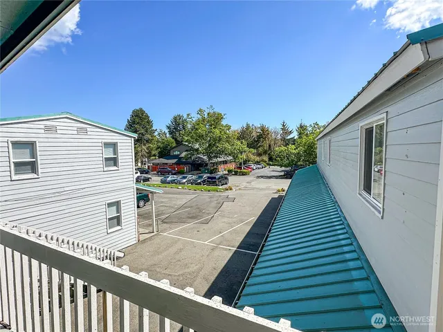 a view of a backyard with sitting area