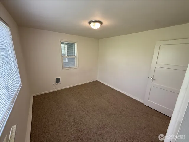 en empty room with windows