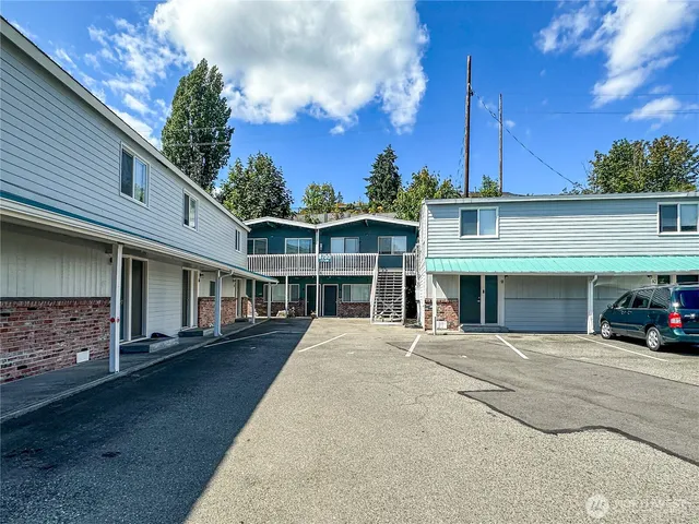 a view of a car park in front of house