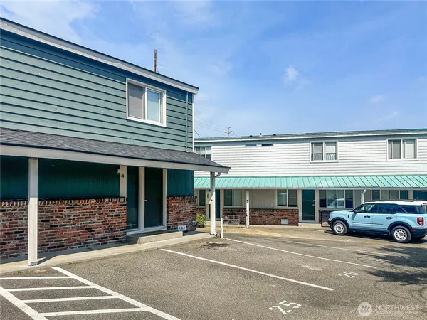 a view of a car parked in front of a building