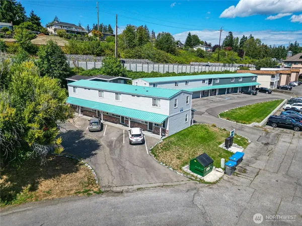 an aerial view of a house with a swimming pool patio and outdoor seating