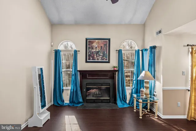 a view of a livingroom with furniture and a fireplace