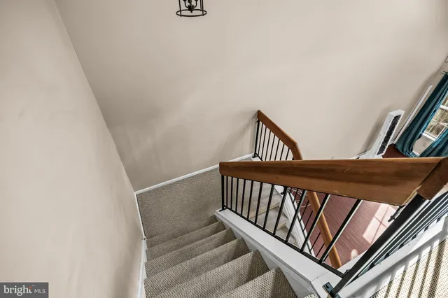 a view of a hallway with staircase