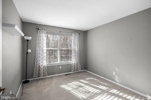 a view of a brick house with many windows