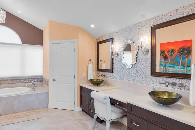 a bed room with a bed and a chair