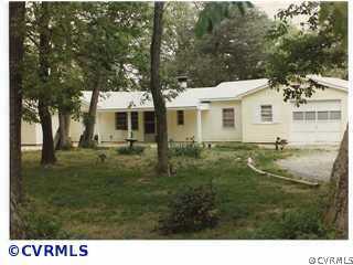 a view of house with a garden