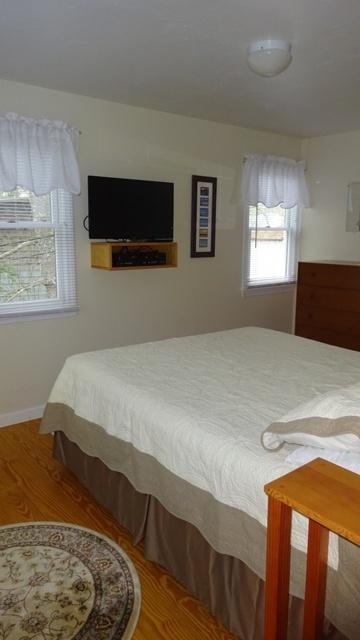 27 Hideaway Road, Unit G Buzzards Bay, MA 02532 - Photo 15 of 34 a bedroom with a bed and a window