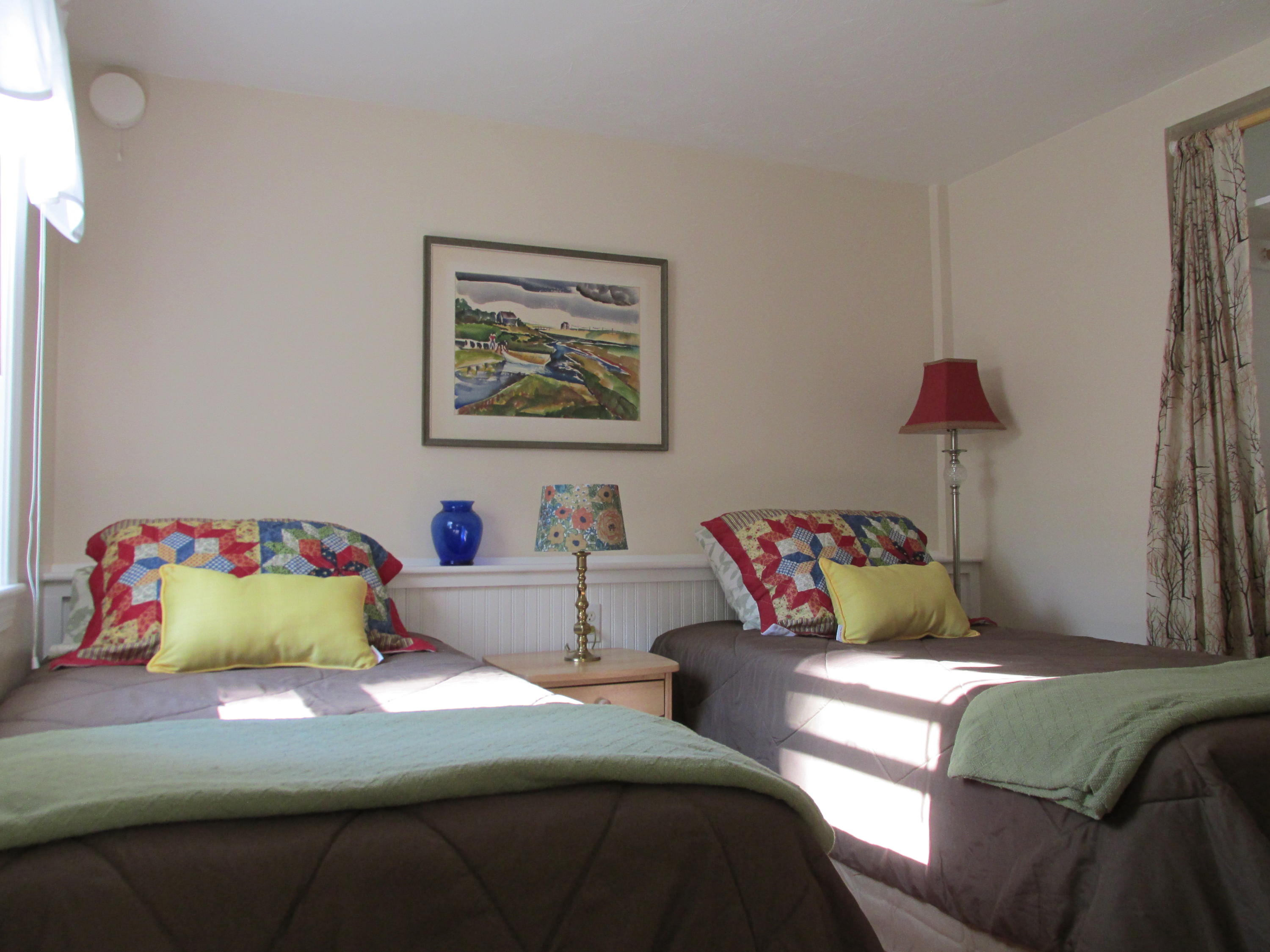 27 Hideaway Road, Unit G Buzzards Bay, MA 02532 - Photo 16 of 34 a bedroom with a bed and a lamp