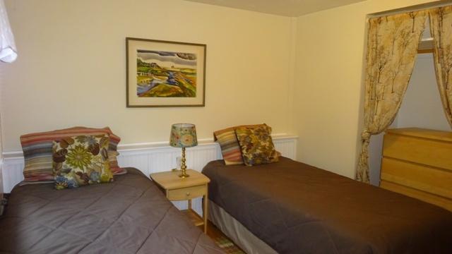 27 Hideaway Road, Unit G Buzzards Bay, MA 02532 - Photo 18 of 34 a bedroom with a bed and wooden floor
