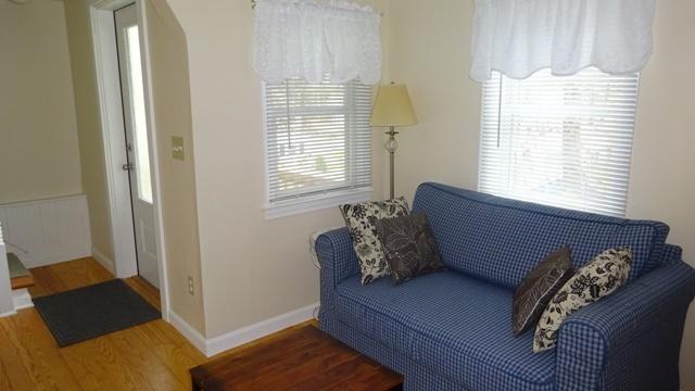 27 Hideaway Road, Unit G Buzzards Bay, MA 02532 - Photo 20 of 34 a bed sitting in a bedroom next to a window