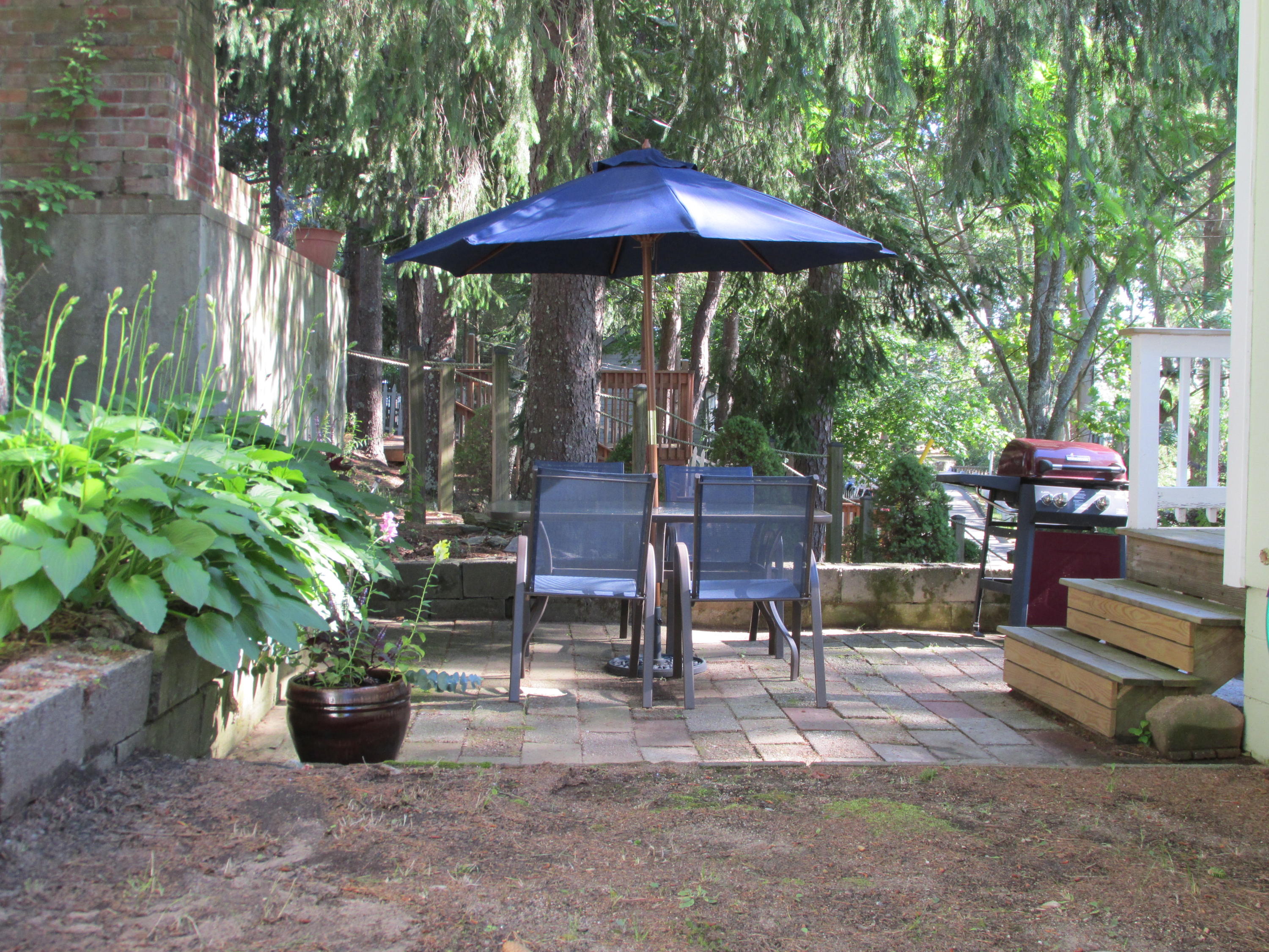 27 Hideaway Road, Unit G Buzzards Bay, MA 02532 - Photo 2 of 34 a view of a patio with chairs and plants
