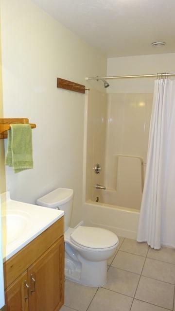 27 Hideaway Road, Unit G Buzzards Bay, MA 02532 - Photo 22 of 34 a bathroom with a toilet a sink and shower