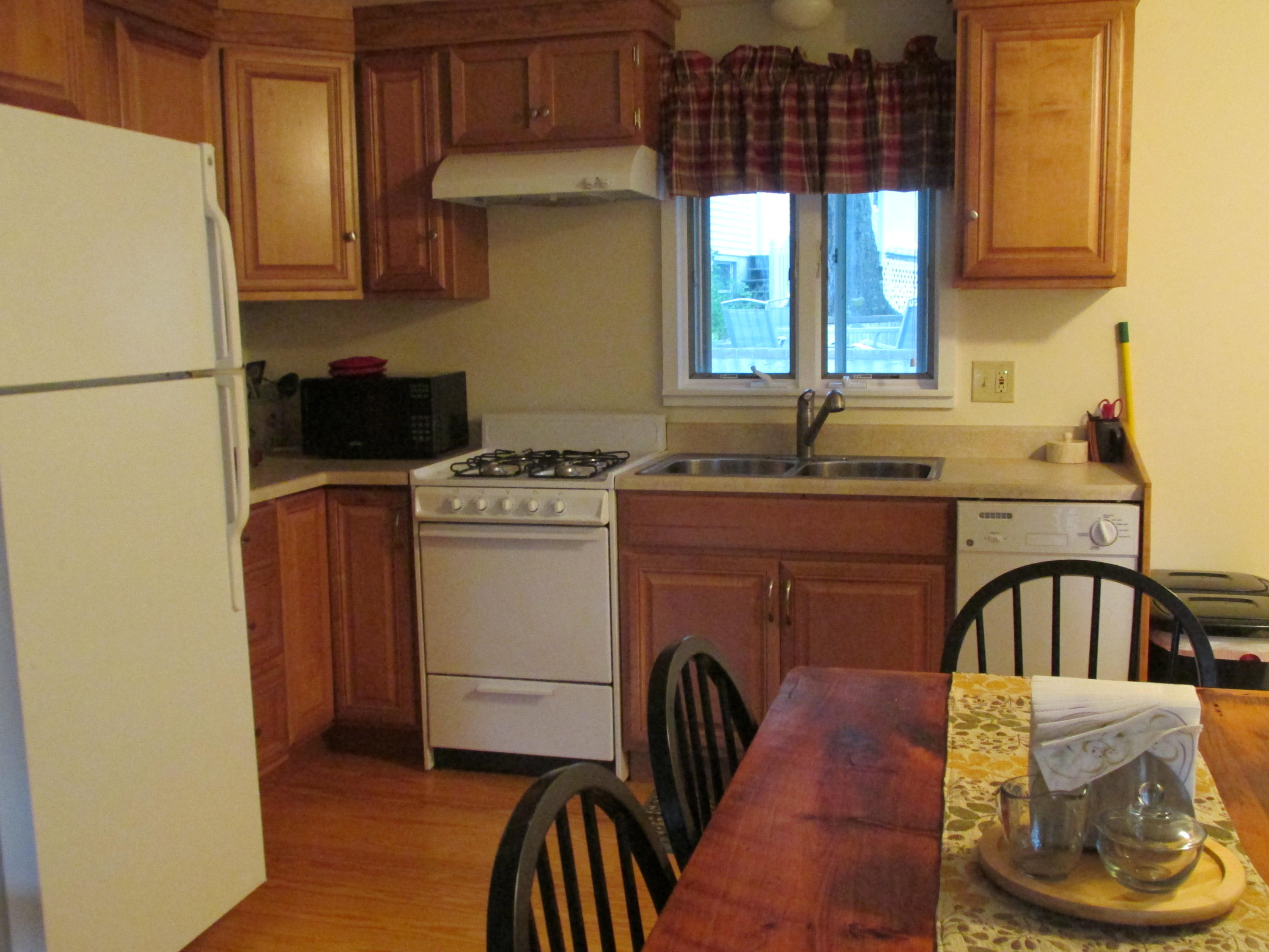 27 Hideaway Road, Unit G Buzzards Bay, MA 02532 - Photo 3 of 34 a kitchen with a sink a stove and refrigerator