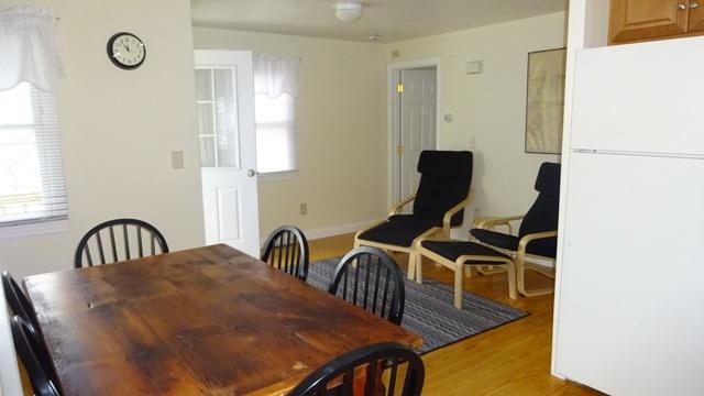 27 Hideaway Road, Unit G Buzzards Bay, MA 02532 - Photo 6 of 34 a view of a dining room with furniture and a window