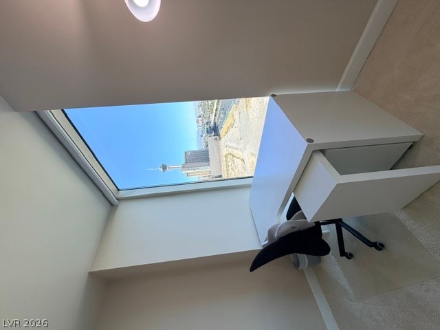 2777 Paradise Road, Unit 807 Las Vegas, NV 89109 - Photo 14 of 61 An airy workspace provides compelling urban views through a wide window.